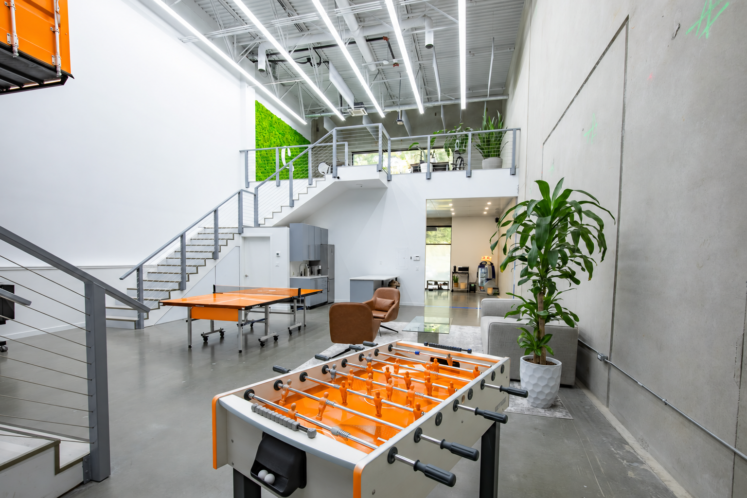 Choquer Agency office with orange foosball and ping pong tables